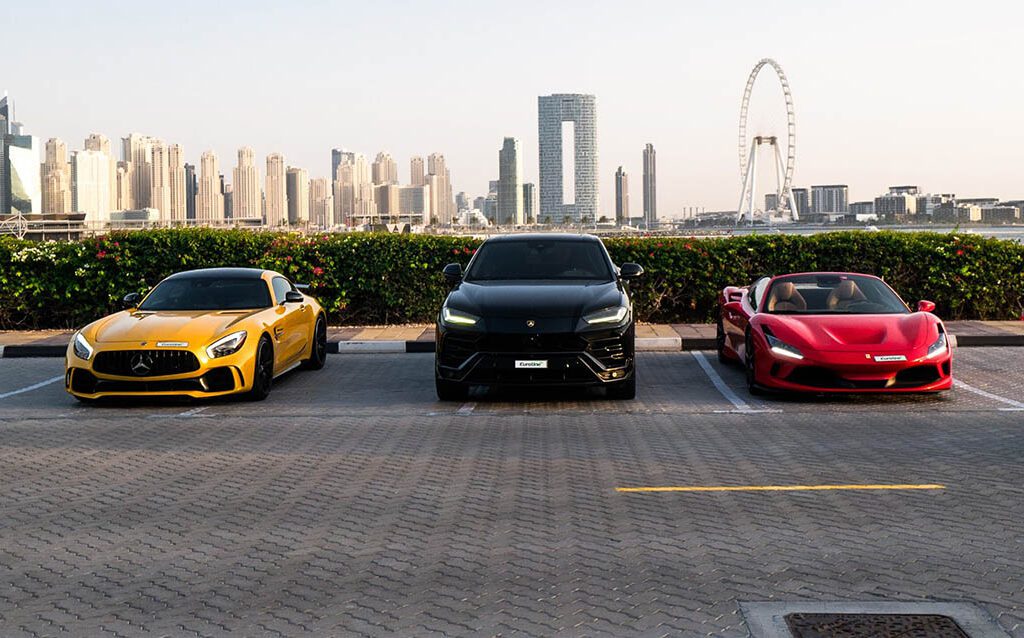 luxury cars in a beautiful Dubai setting